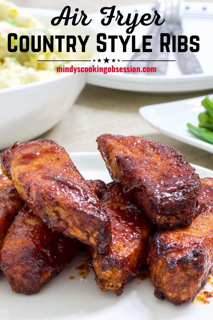 Close up of the cooked ribs on a white plate and the recipe title in text at the top.