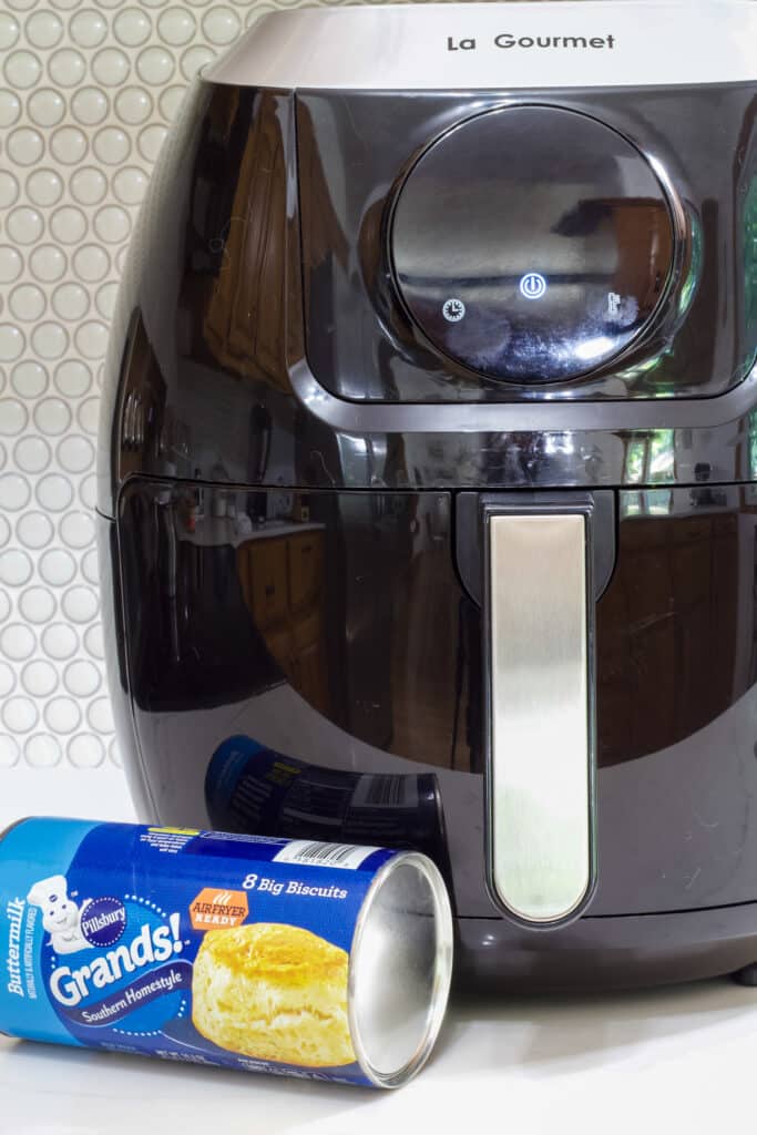 A can of Pillsbury grands biscuits sitting on the counter in front of my air fryer.