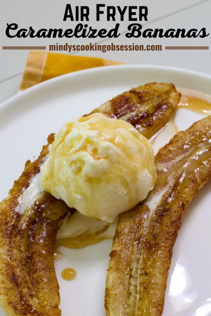 Two air fried bananas halves on a plate with a scoop of vanilla ice cream topped with caramel sauce. The recipe title is in text at the top.
