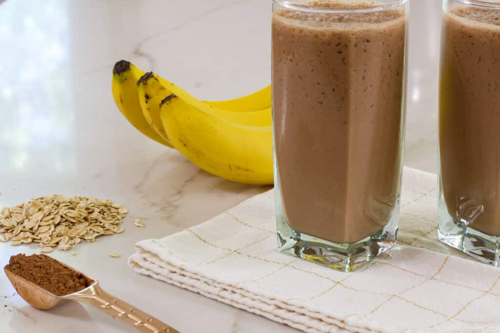 A smoothie, three bananas, some oats and a tablespoon full of cocoa powder.