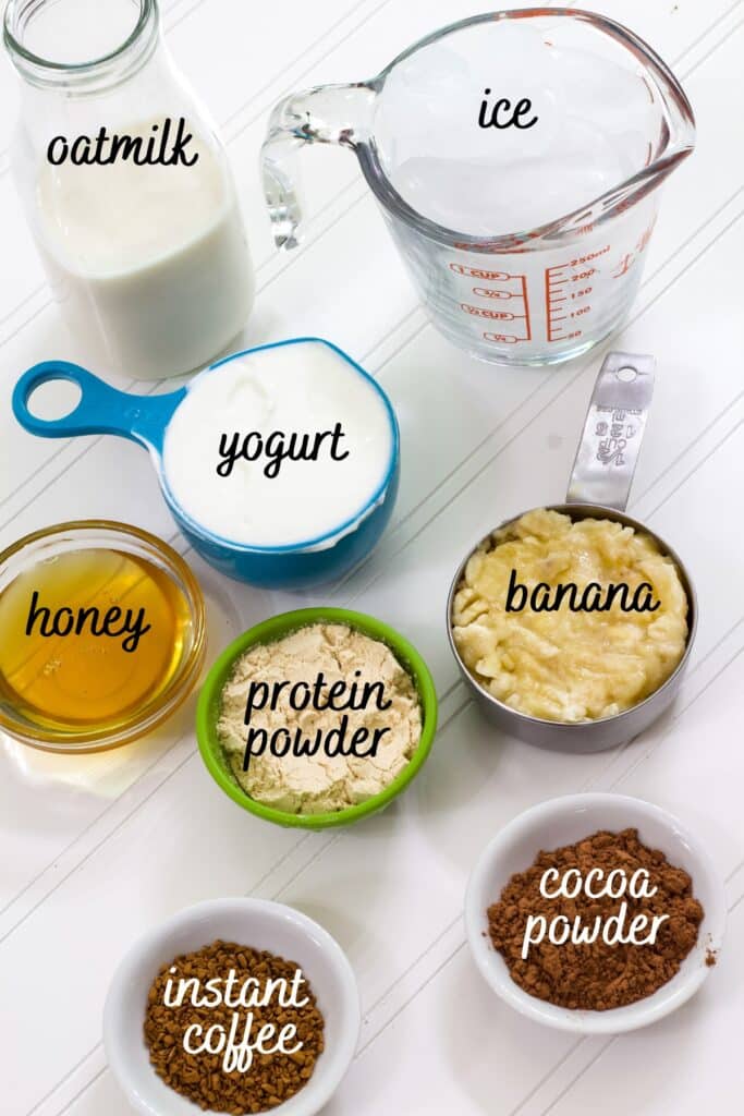 All of the ingredients measured out in individual bowls labeled with text what they are.