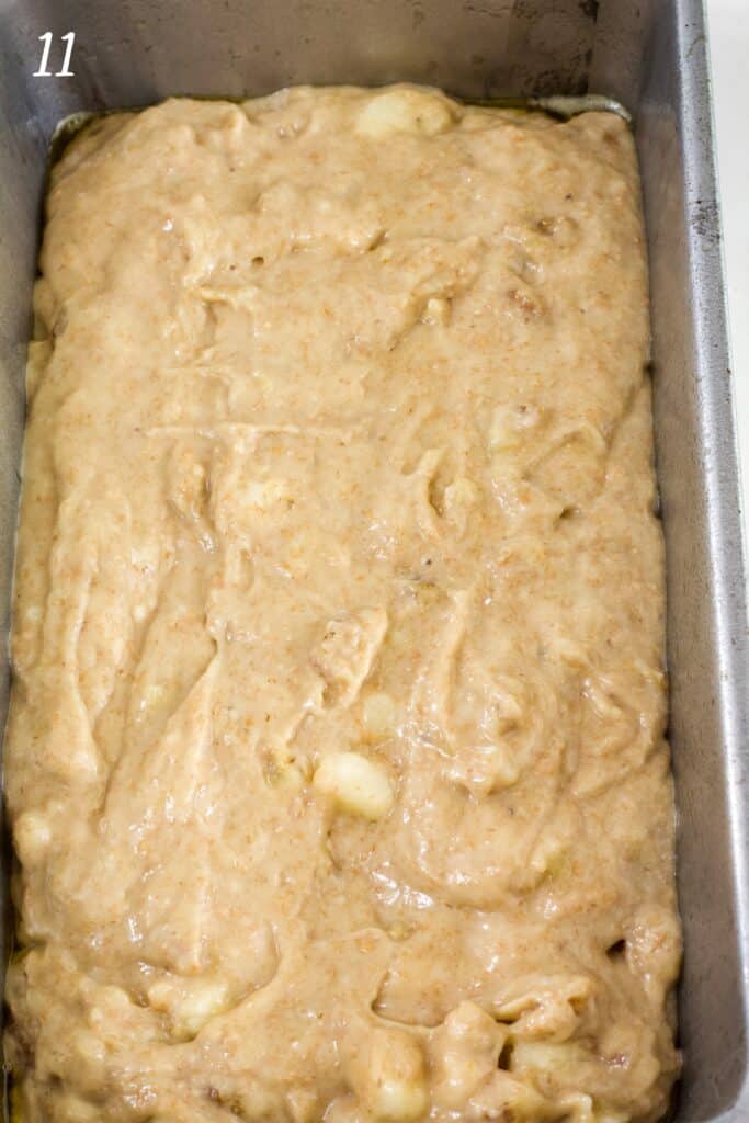 The banana bread batter in a loaf pan before it has been baked.