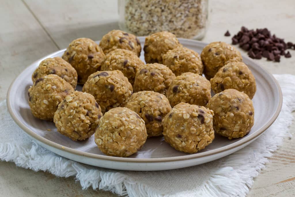 A plate full of 4 Ingredient Protein Rich Peanut Butter Energy Balls.