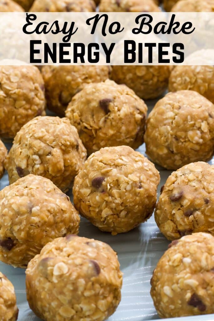 Many protein balls sitting on a turquoise colored sheet pan, the recipe title is at the top.