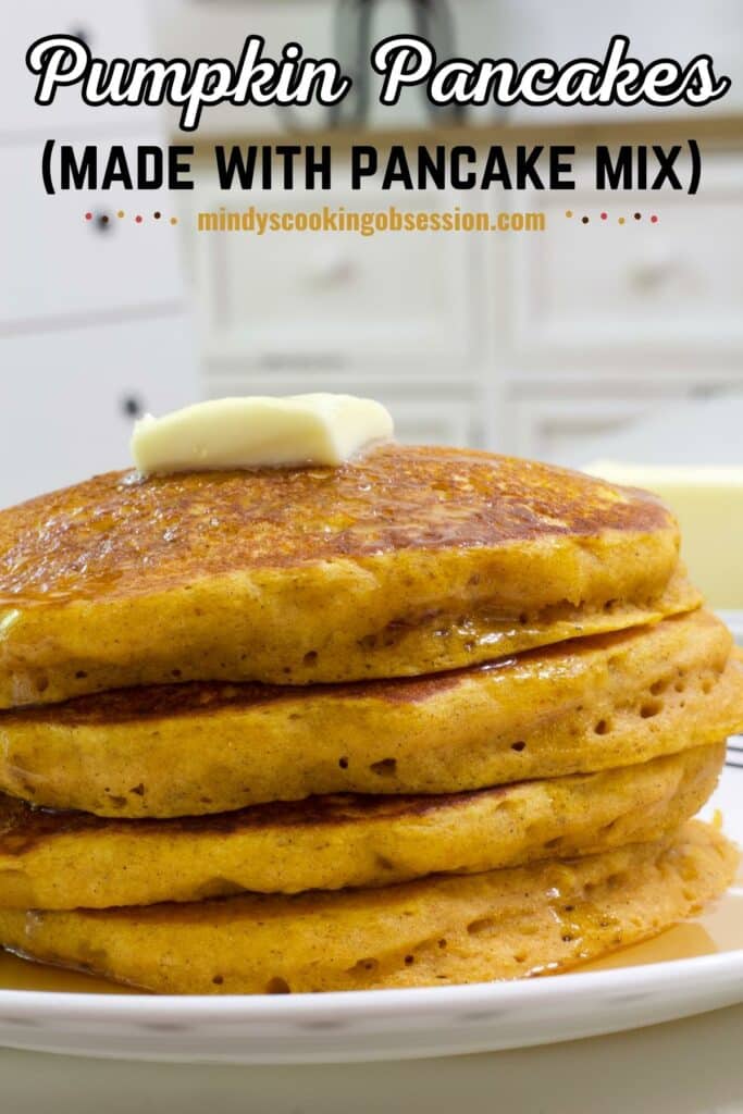 A stack of 4 pumpkin pancakes on a plate with butter and syrup on them. The recipe title is at the top in text.