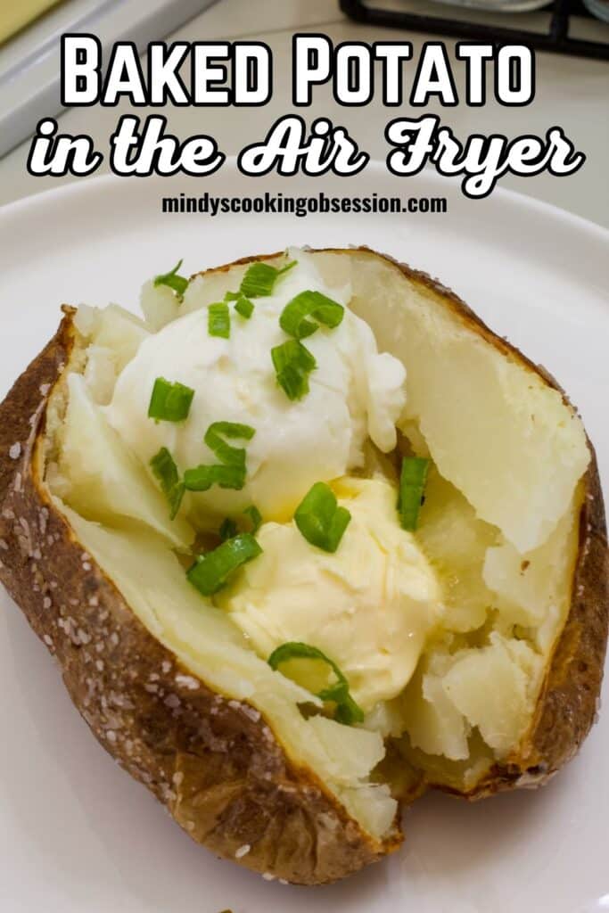 A baked potato topped with butter, sour cream and green onions with the recipe title is at the top in text.