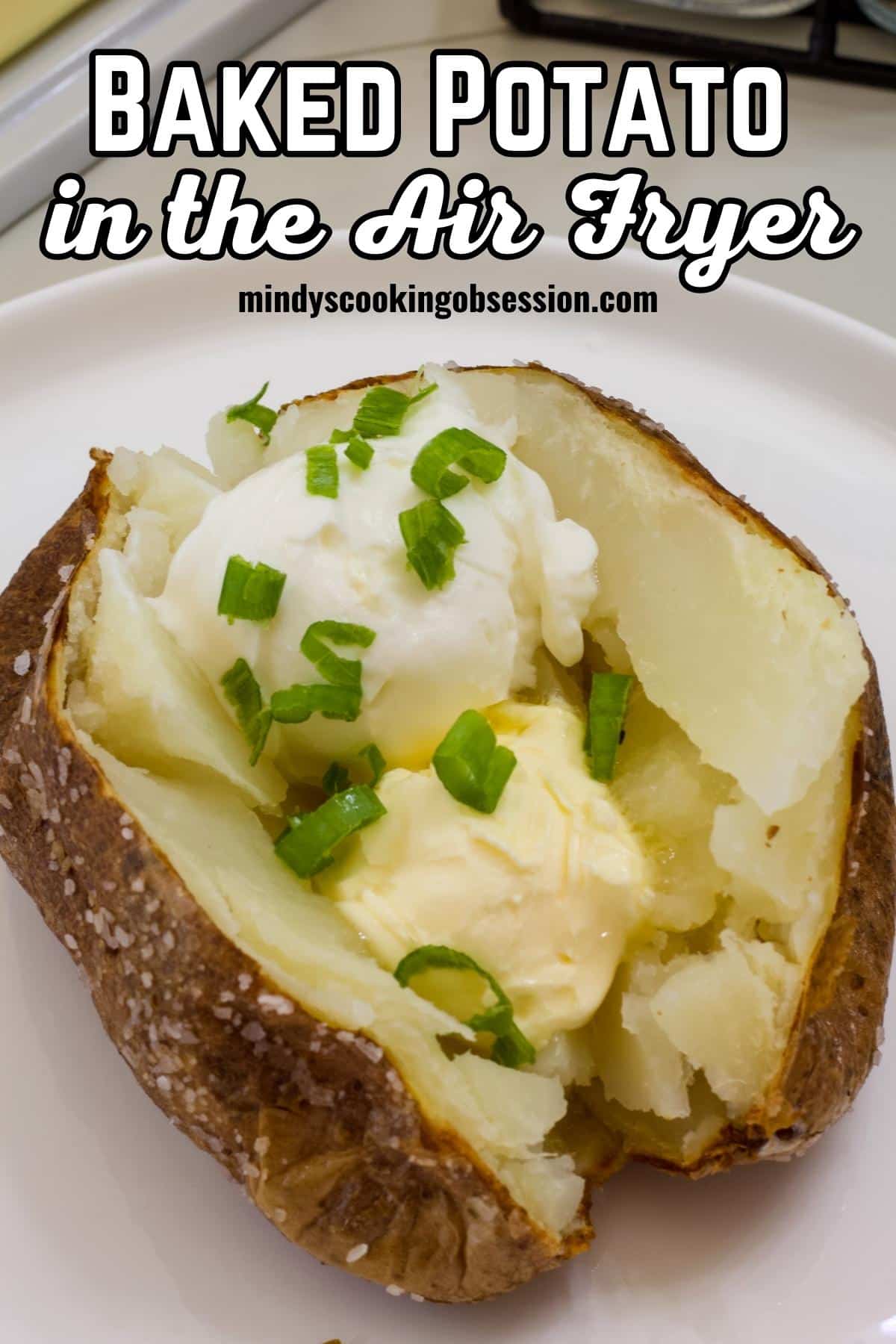 Quick and Easy Air Fryer Baked Potato Recipe makes the perfect easy side dish or entree in a fraction of the time using basic ingredients. via @mindyscookingobsession