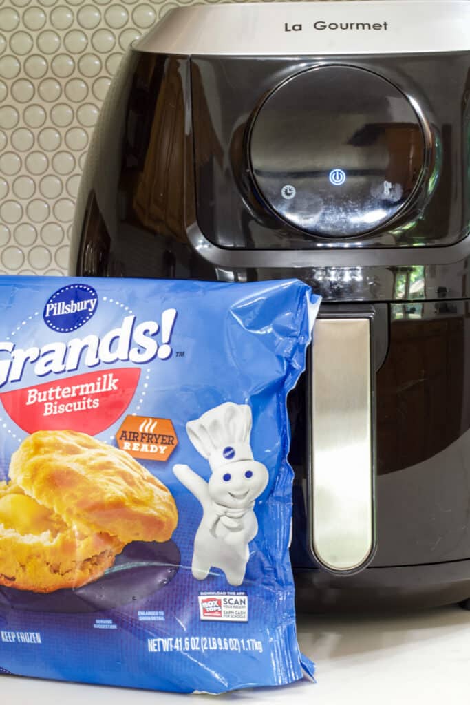 A bag of Pillsbury Grands frozen biscuits and a LaGourmet 7.2 quart air fryer on a counter.