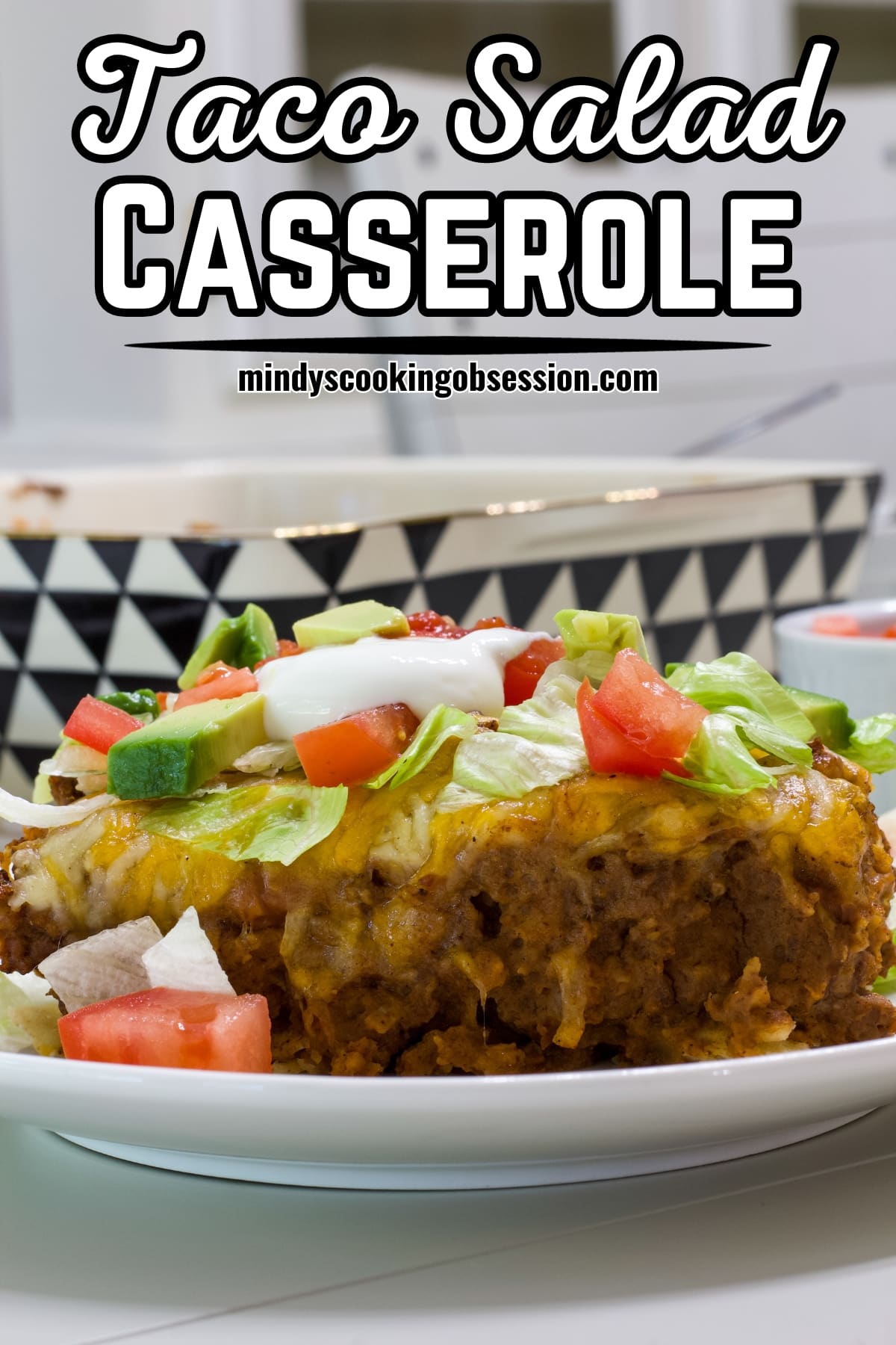 Easy Taco Salad Casserole Recipe with Beef & Beans - A delicious twist on a classic. Perfectly cheesy for a quick hearty and satisfying meal! via @mindyscookingobsession