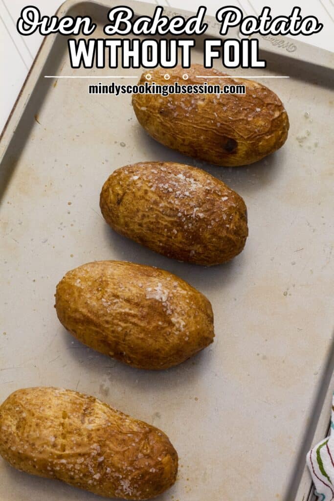 Four Perfect Baked Potato in the Oven with No Foil on a rimmed baking sheet with the recipe title at the top in text.