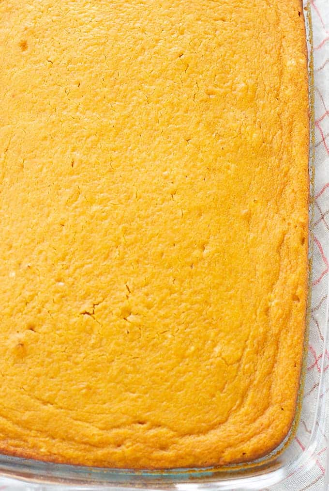 The baked pumpkin pie cake in a glass pan.