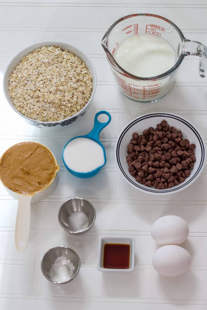 All if the ingredients to make The Easiest Chocolate Chip Baked Oatmeal Recipe measured in individual bowls.