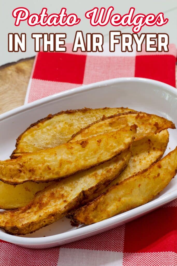 Potato wedges on a white plate and the recipe title is in text at the top of the image.