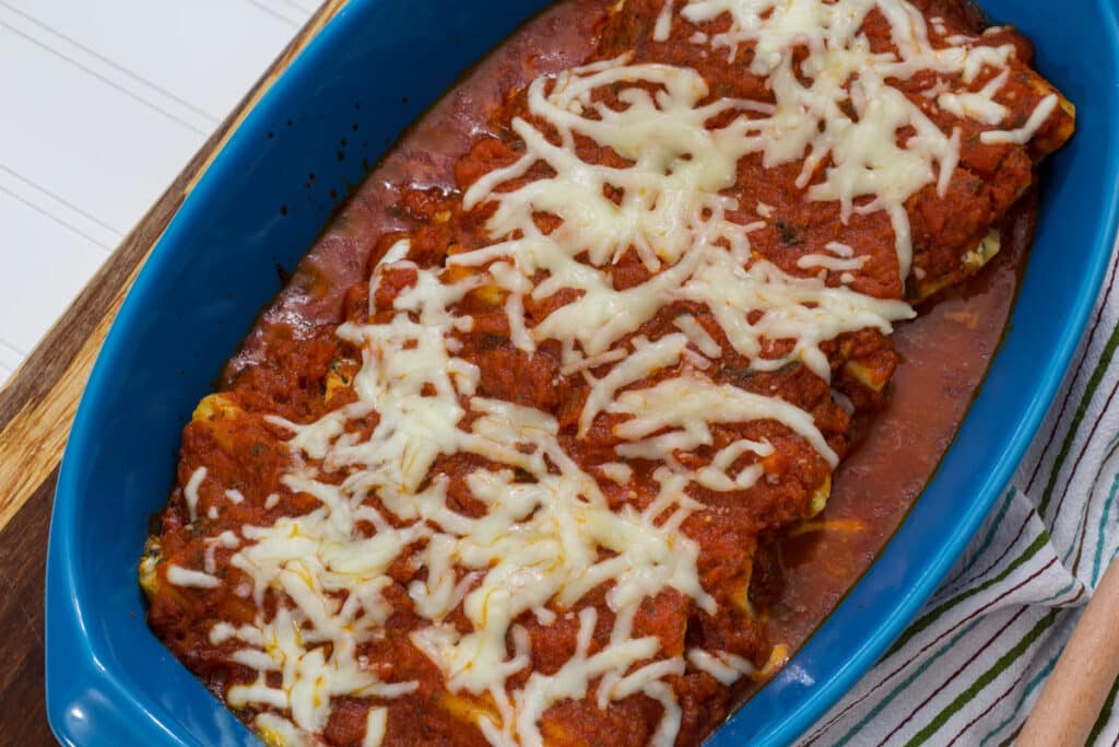 Overhead view of the casserole dish full of Cheese & Spinach Stuffed Manicotti.