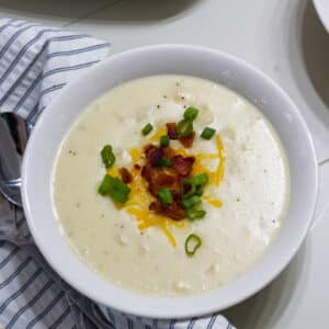 One bowl Outback Steakhouse Potato Soup with toppings, this is the feature image for this post.