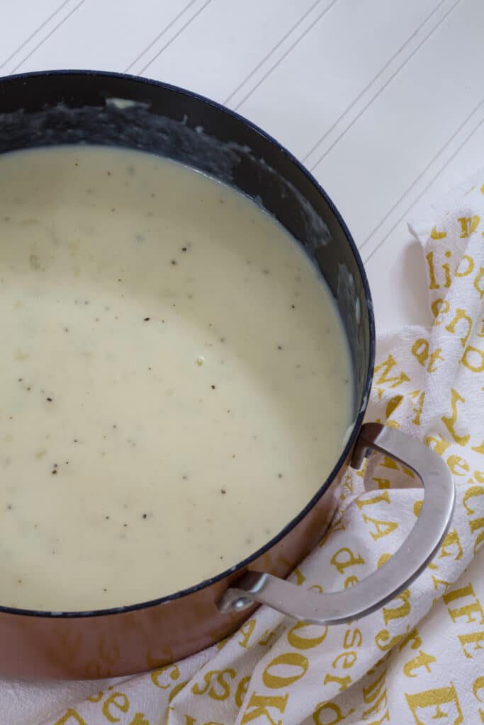 A large dutch oven filled with the finished Outback Steakhouse Potato Soup.