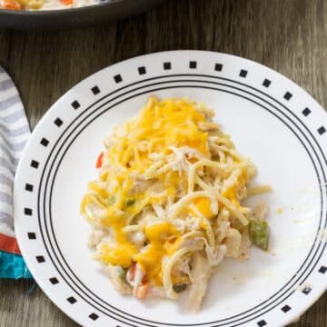 One serving pf Cheesy Chicken Spaghetti Casserole on a white plate.