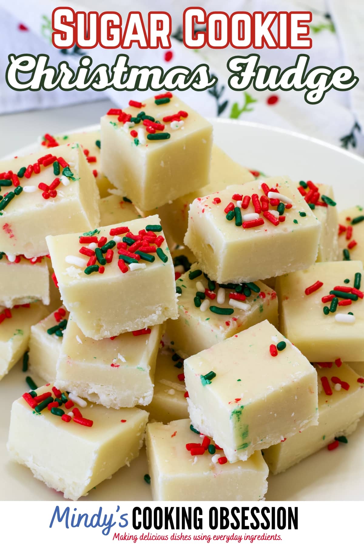 Whip up this Sugar Cookie Christmas Fudge recipe with just 5 ingredients! Impress your guests with this deliciously festive treat. via @mindyscookingobsession