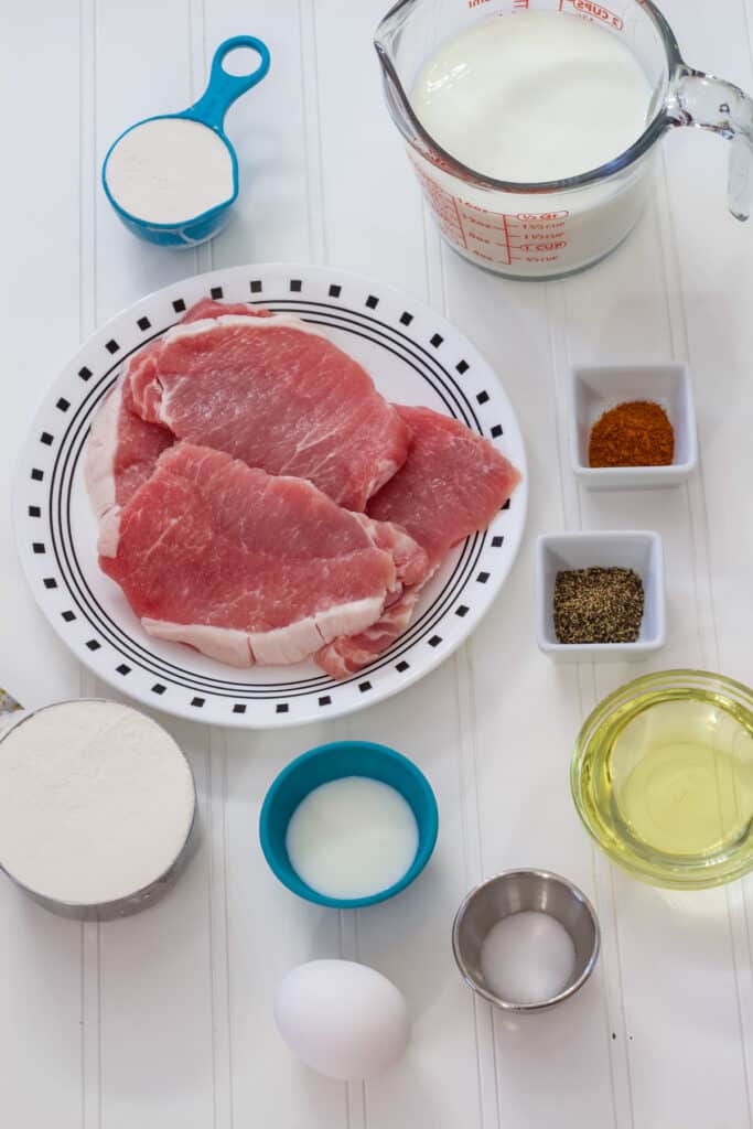 All of he ingredients measure out to make the The Best Crispy Southern Fried Pork Chops Recipe and sawmill gravy.