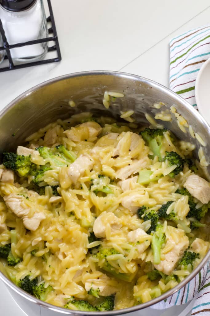 A pan full of the finished Cheesy Chicken & Broccoli Orzo.