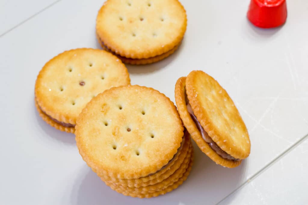 Overhead view of a stack of two rolo ritz cracker treats with one leaned up against the stack.