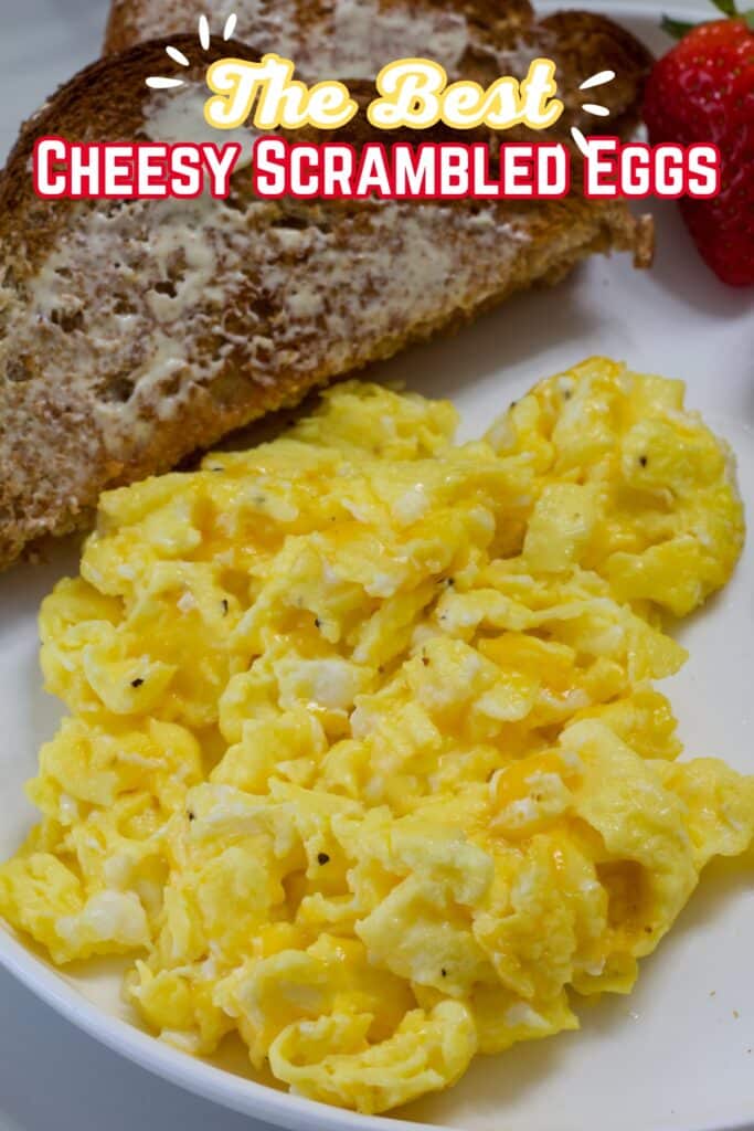 The plate with scrambled eggs with cheese and the recipe title in text above it.