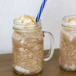 One whole glass and half of a glass full of Copycat Starbucks Salted Caramel Mocha Frappuccino.