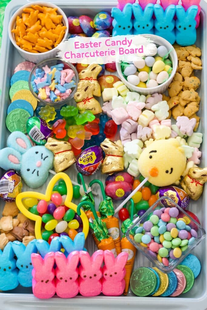The entire tray of Easter goodies and the words easter candy charcuterie board in text at the top.
