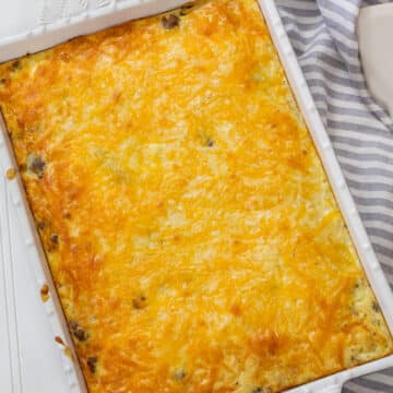 The feature image of the whole baked casserole in a white ceramic baking dish.