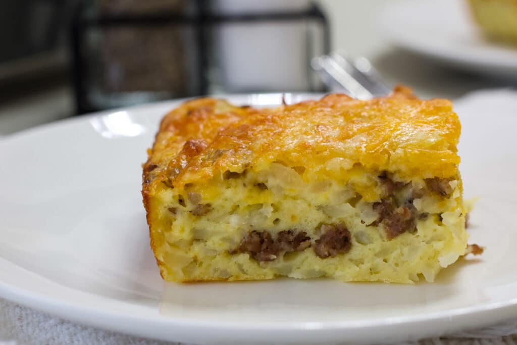 One serving of Easy Bisquick Sausage Breakfast Casserole so the inside is visible.