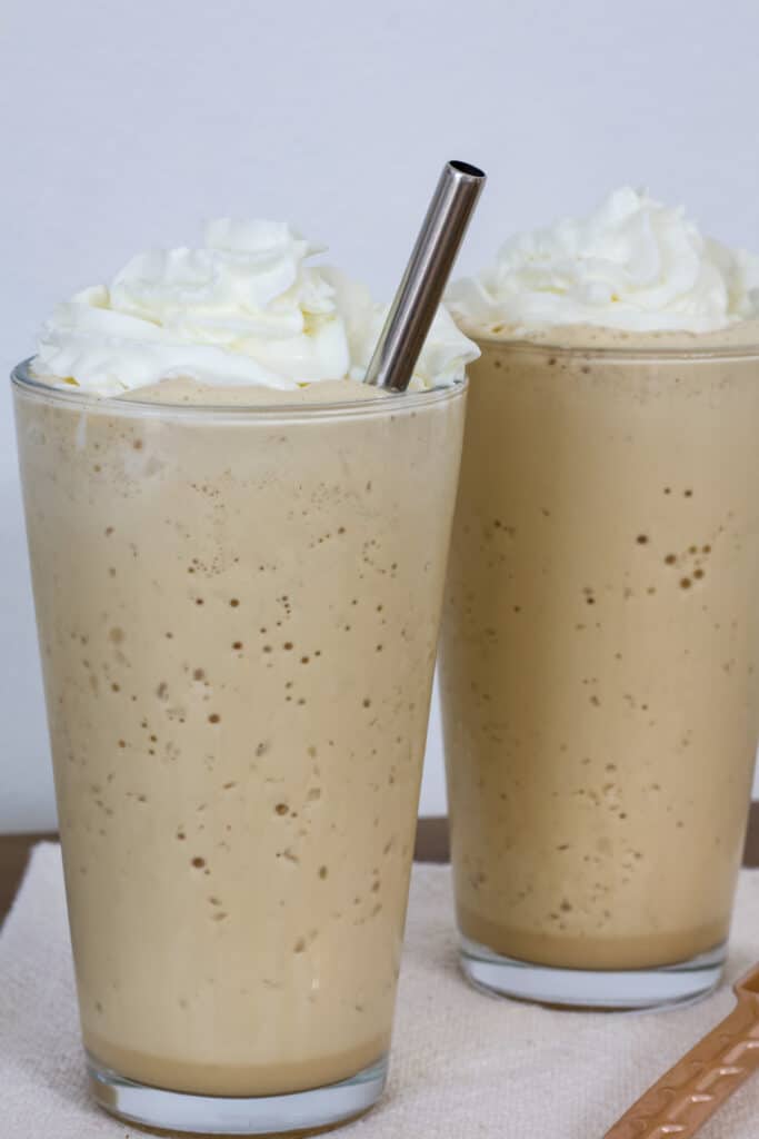 Two tall glasses of copycat starbucks vanilla frappuccino.