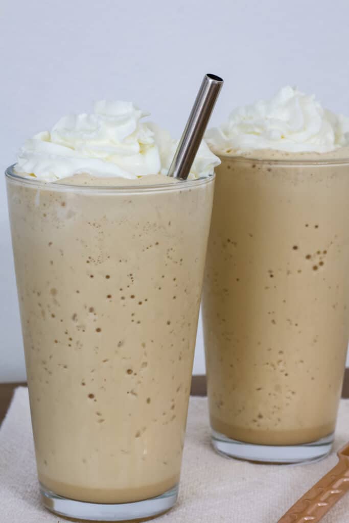 Two tall glasses of copycat starbucks vanilla frappuccino.