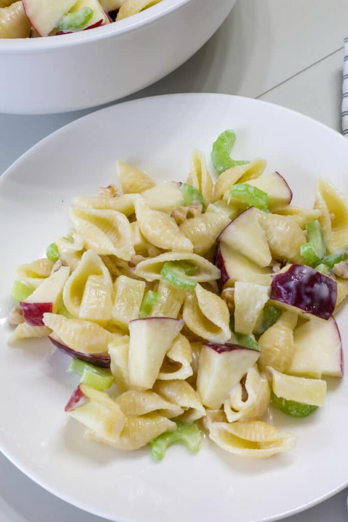 One serving of Waldorf Pasta Salad with Pineapple on a white plate.