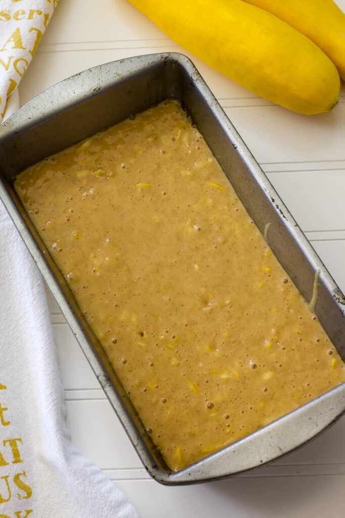 The mixed squash bread batter in the prepared loaf pan ready to go into the oven.