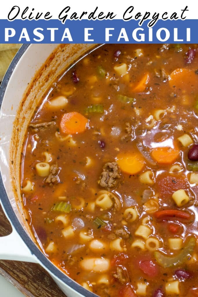 A pan of pasta e fagioli soup, the recipe title is in text at the top.