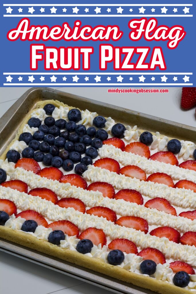 The uncut fruit pizza, the recipe title is in text at the top, the text has a star boarder.