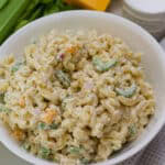 Overhead shot of the serving bowl full of Macaroni Pasta Salad with Cheddar Cheese.