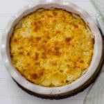 Feature image of the entire cheesy scalloped potato dish that just came out of the oven.