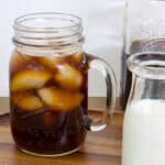 Closer shot of the mason jar mug of black iced cold brew.
