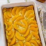 Feature image of the whole baked Overnight Peach French Toast Casserole .