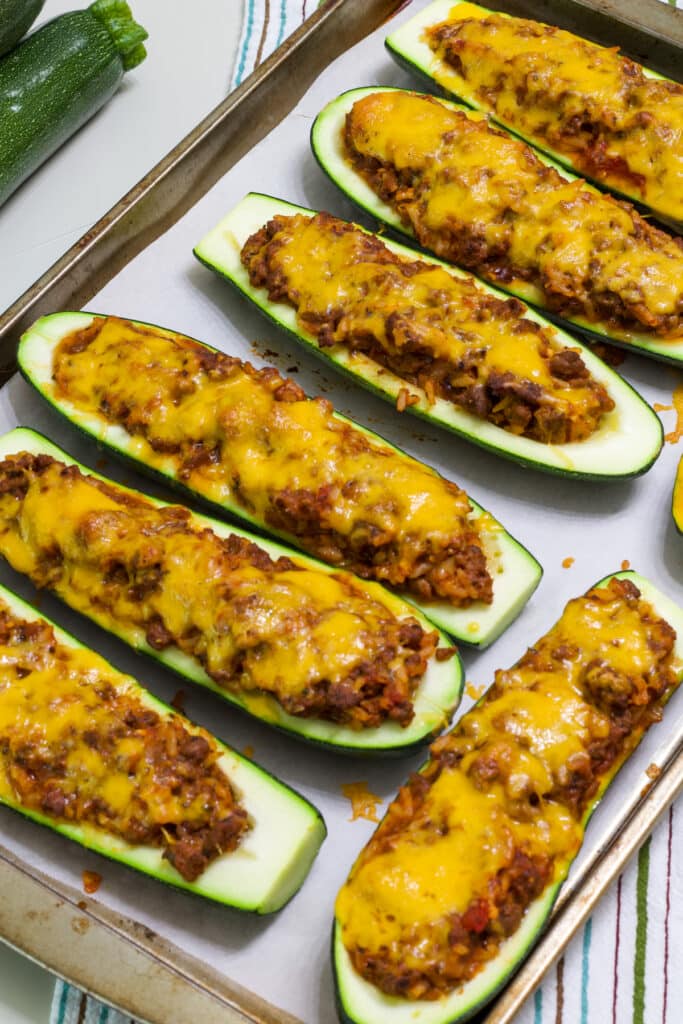 The cooked zucchini boats on the sheet pan after they came out of the oven.