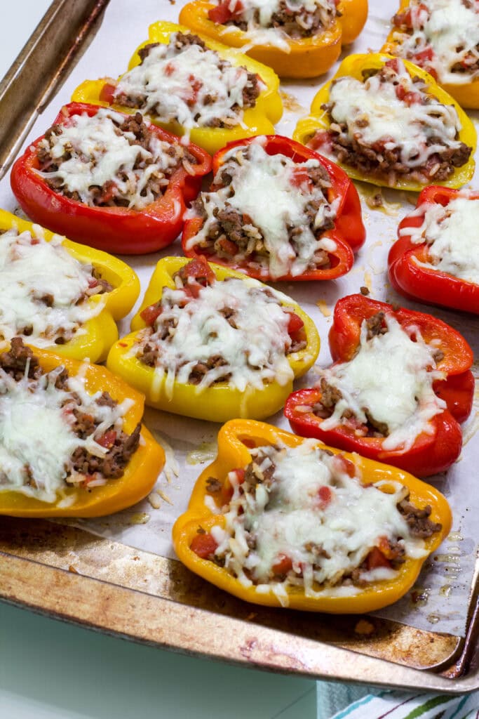 The stuffed peppers on the rimmed baking sheet after they came out of the oven.