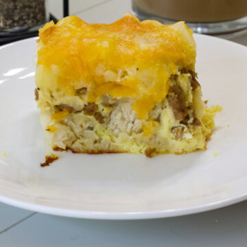 Feature image of one serving of baked casserole on a white plate.