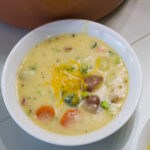The feature image of one serving of soup in a white bowl.