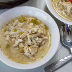 Feature image of a close up shot of one bowl of Southwest Creamy White Chicken Chili.