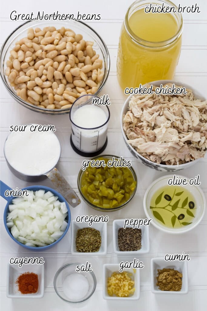 All of the ingredients needed to make the white chili, they are labeled with the name of the ingredient.
