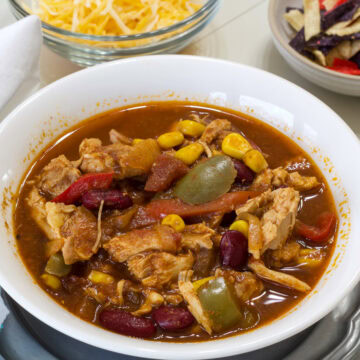 Feature image of one serving of soup in a white bowl.