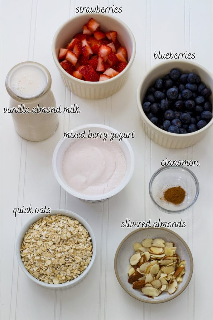 The berries, milk, yogurt, oats, cinnamon, and slivered almonds measured out to make 2 servings.