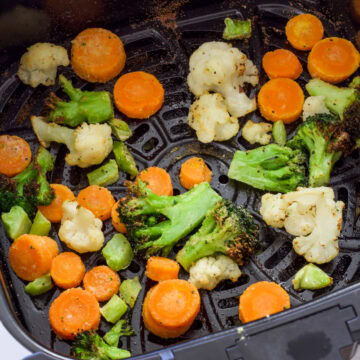 Feature image of the vegetables in the air fryer basket after they have been air fried.