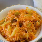 Feature image of a very close up of one serving of salad in a small china bowl.